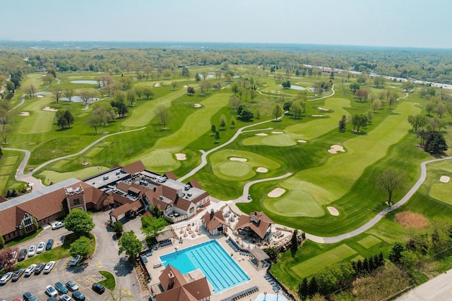 aerial view of a large body of water, a pool, and a local golf course