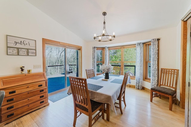 N4404 Pine Dr, Montello, WI 53949 - dining space featuring a chandelier, light wood finished floors, and vaulted ceiling
