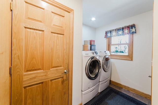 N4404 Pine Dr, Montello, WI 53949 - laundry area featuring washing machine and clothes dryer, baseboards, inlaid floor details, dark tile patterned flooring, and recessed lighting