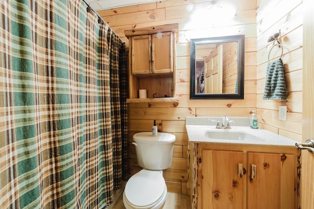 N4404 Pine Dr, Montello, WI 53949 - full bathroom with vanity, wood walls, toilet, and a shower with curtain