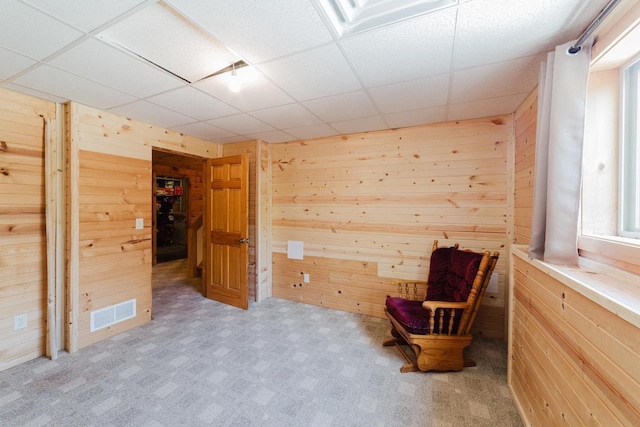 N4404 Pine Dr, Montello, WI 53949 - living area with wood walls, a drop ceiling, and carpet