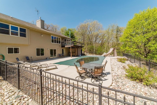 N4404 Pine Dr, Montello, WI 53949 - view of pool featuring a water slide, a patio, and fence