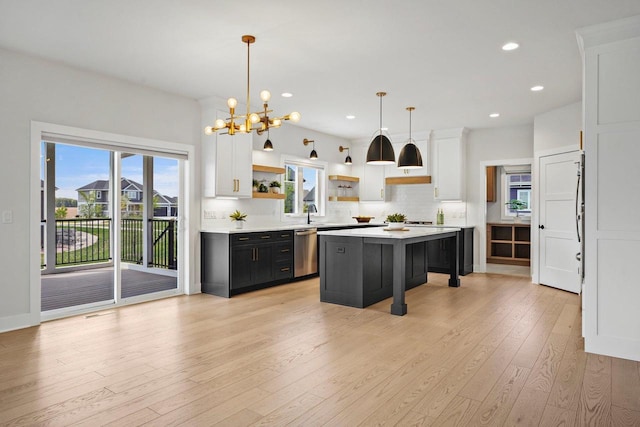 815 Steven Vw, Waunakee, WI 53597 - kitchen featuring dishwasher, open shelves, light countertops, white cabinetry, and decorative backsplash