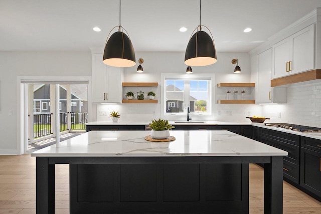 815 Steven Vw, Waunakee, WI 53597 - kitchen featuring open shelves, a sink, stainless steel gas cooktop, healthy amount of natural light, and recessed lighting