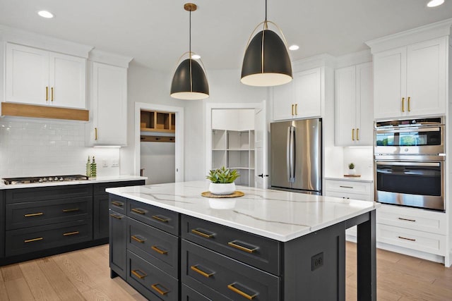 815 Steven Vw, Waunakee, WI 53597 - kitchen featuring stainless steel appliances, white cabinetry, decorative backsplash, recessed lighting, and light wood finished floors