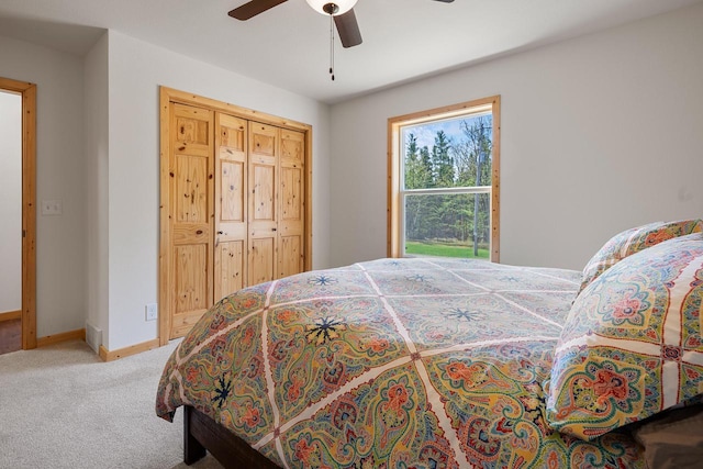 12450 Nixon Rd, Minocqua, WI 54548 - carpeted bedroom with baseboards and a ceiling fan