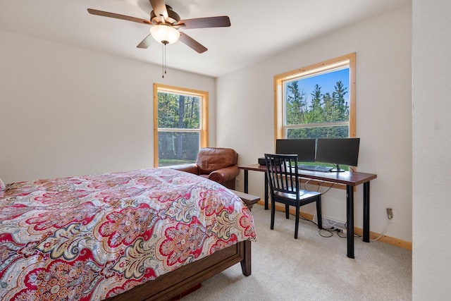 12450 Nixon Rd, Minocqua, WI 54548 - bedroom with carpet floors, baseboards, and a ceiling fan