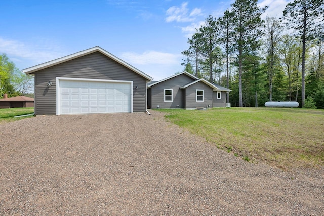 12450 Nixon Rd, Minocqua, WI 54548 - single story home with a garage, a front lawn, and an outbuilding