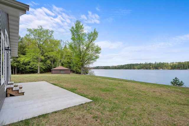 12450 Nixon Rd, Minocqua, WI 54548 - view of grassy yard featuring a patio and a water view