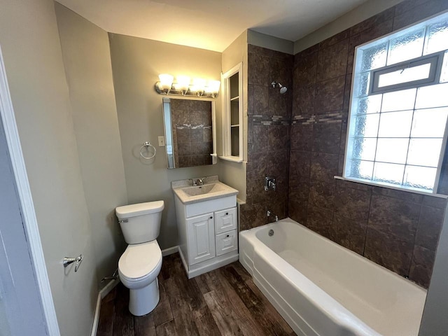 923 E Clarke St, Milwaukee, WI 53212 - full bathroom with wood finished floors, plenty of natural light, bathtub / shower combination, and toilet