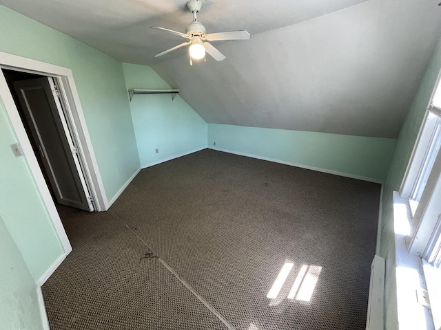 923 E Clarke St, Milwaukee, WI 53212 - additional living space with lofted ceiling, ceiling fan, baseboards, and dark carpet