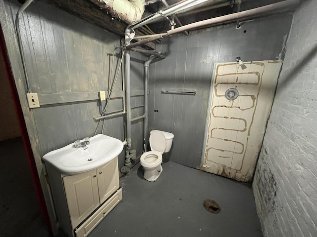 923 E Clarke St, Milwaukee, WI 53212 - bathroom with concrete floors, toilet, a shower, and vanity