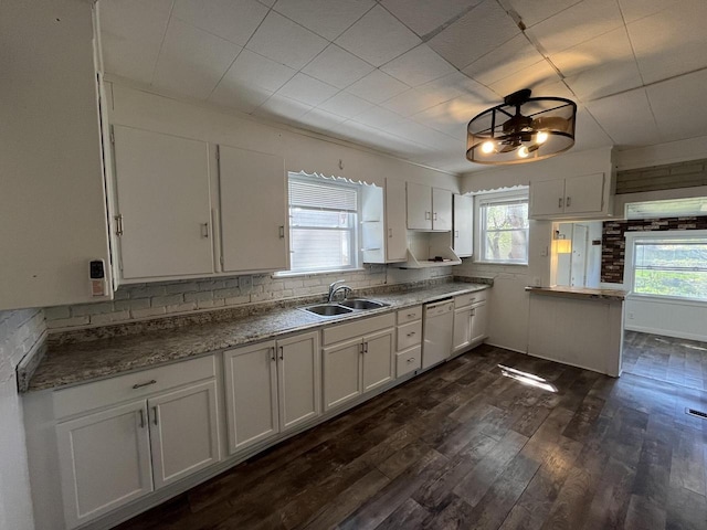 923 E Clarke St, Milwaukee, WI 53212 - kitchen featuring a sink, dishwasher, white cabinetry, and dark wood-type flooring