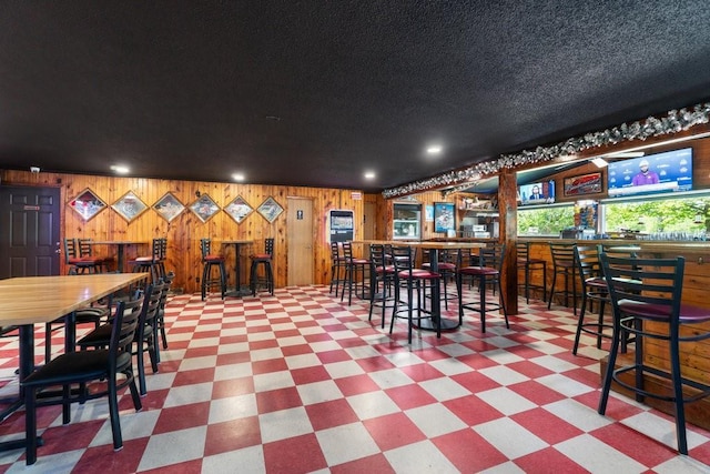 30994 122nd St, New Auburn, WI 54757 - community bar area with tile patterned floors, wood walls, and recessed lighting