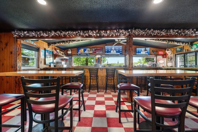 30994 122nd St, New Auburn, WI 54757 - community bar area featuring tile patterned floors, recessed lighting, wood walls, a textured ceiling, and a ceiling fan