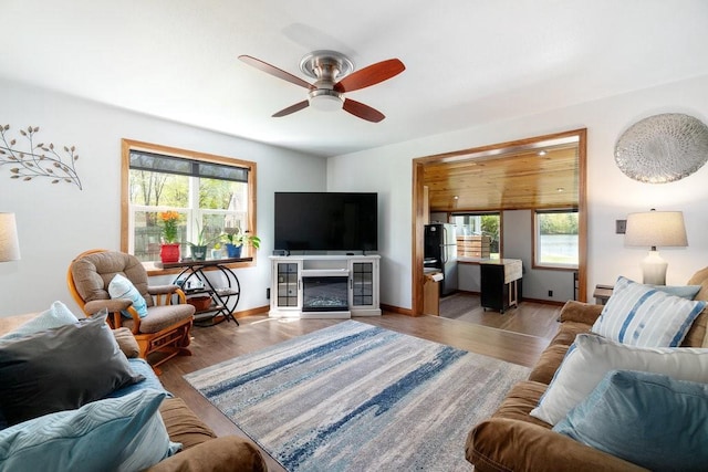 30994 122nd St, New Auburn, WI 54757 - living room featuring ceiling fan, wood finished floors, and baseboards