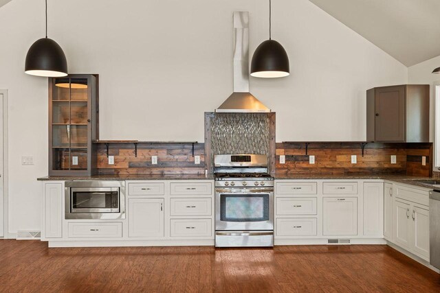 450 Lake Ave, Montello, WI 53949 - kitchen featuring stainless steel appliances, backsplash, dark wood-style floors, wall chimney exhaust hood, and high vaulted ceiling