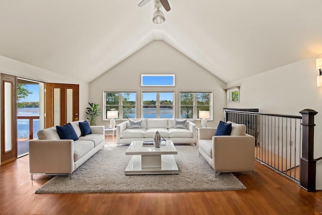 450 Lake Ave, Montello, WI 53949 - living room featuring a water view, wood finished floors, plenty of natural light, and high vaulted ceiling
