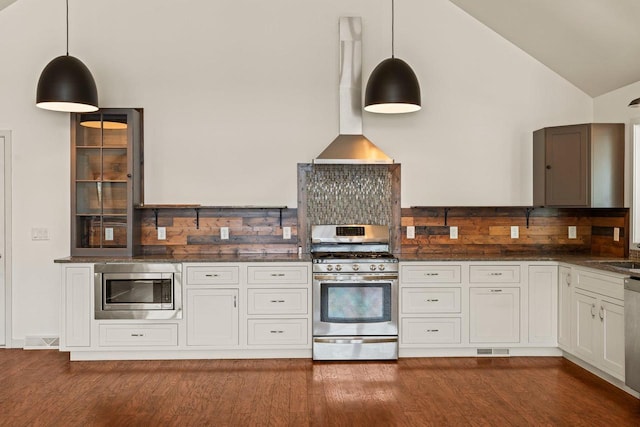 450 Lake Ave, Montello, WI 53949 - kitchen featuring stainless steel appliances, backsplash, dark wood-style floors, wall chimney exhaust hood, and high vaulted ceiling