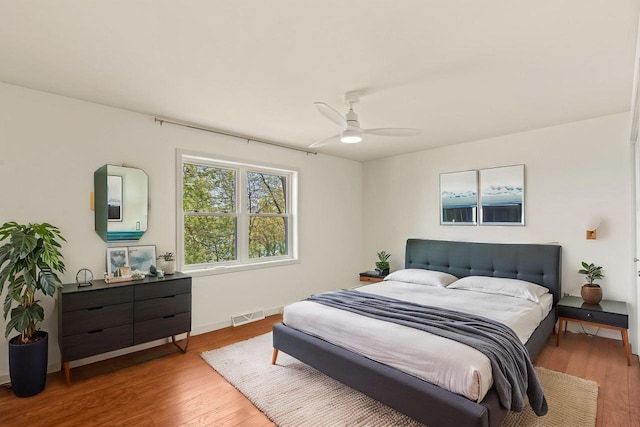 450 Lake Ave, Montello, WI 53949 - bedroom featuring wood finished floors, baseboards, and ceiling fan