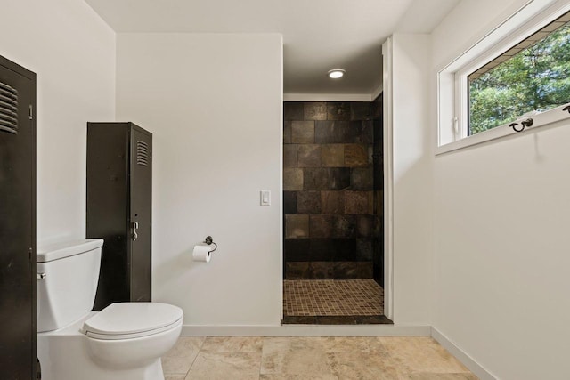 450 Lake Ave, Montello, WI 53949 - full bathroom with baseboards, walk in shower, and toilet
