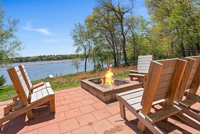 450 Lake Ave, Montello, WI 53949 - view of patio featuring an outdoor fire pit and a water view