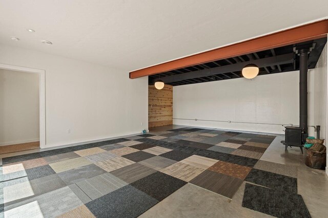 450 Lake Ave, Montello, WI 53949 - spare room with a wood stove and carpet floors