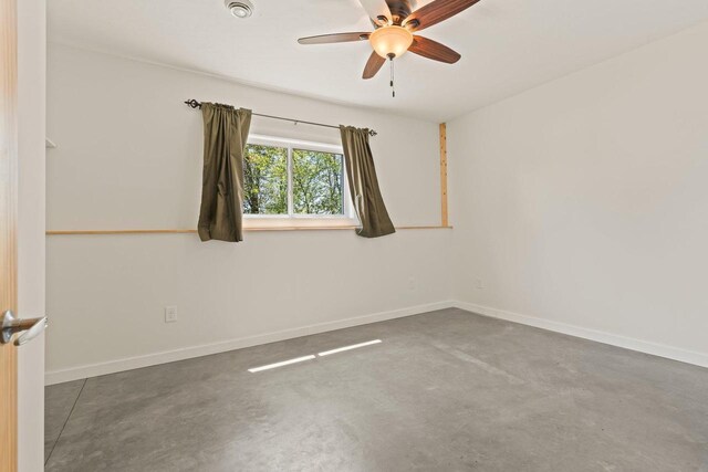 450 Lake Ave, Montello, WI 53949 - spare room with concrete floors, ceiling fan, and baseboards