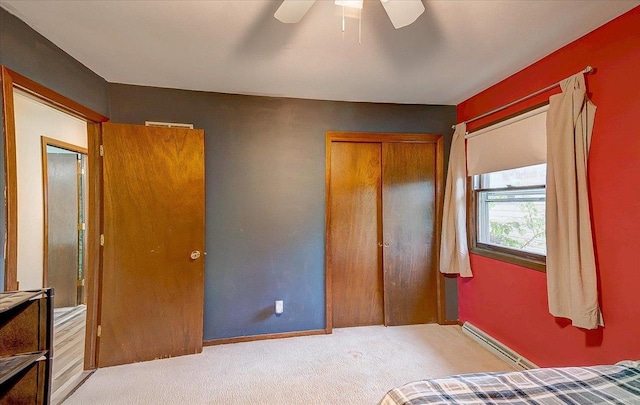 864 Suellen Ln, Portage, WI 53901 - unfurnished bedroom with a baseboard heating unit, carpet, a closet, and a ceiling fan