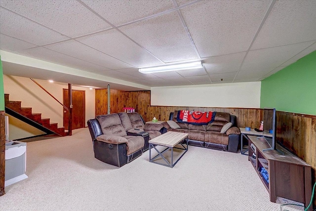 864 Suellen Ln, Portage, WI 53901 - carpeted living area with wooden walls, a drop ceiling, stairway, and wainscoting