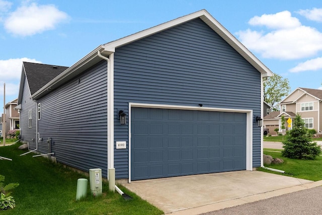 6102 Misty Bridge Rd, Madison, WI 53718 - view of property exterior with a garage and a lawn
