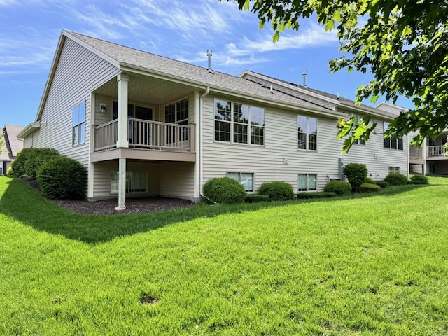 494 Woodfield Cir, Waterford, WI 53185 - view of side of home featuring a lawn and a balcony