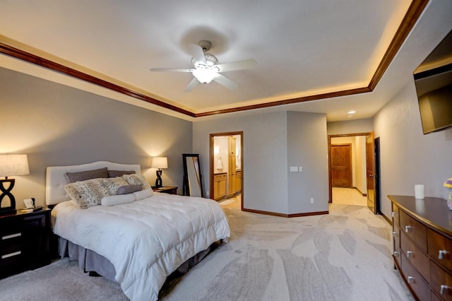 870 Eden Ct, Menasha, WI 54956 - bedroom featuring a tray ceiling, light colored carpet, connected bathroom, baseboards, and a ceiling fan
