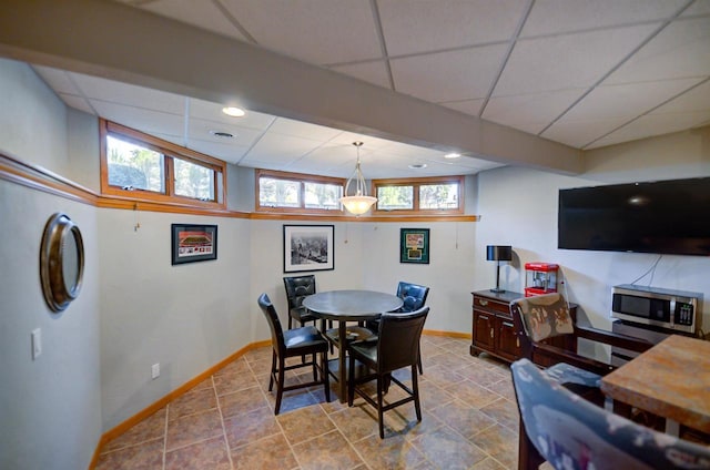 870 Eden Ct, Menasha, WI 54956 - dining area featuring a drop ceiling and baseboards