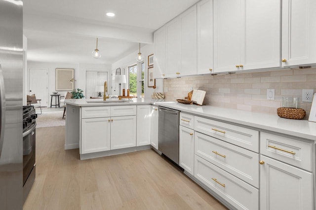 2285 N 166th St, Brookfield, WI 53005 - kitchen with stainless steel dishwasher, a sink, white cabinetry, tasteful backsplash, and recessed lighting