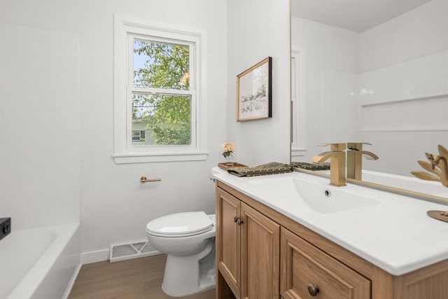 2285 N 166th St, Brookfield, WI 53005 - full bathroom with toilet, wood finished floors, vanity, and baseboards