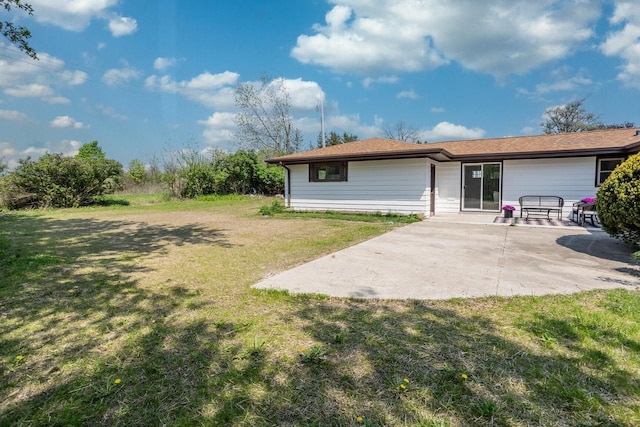 2285 N 166th St, Brookfield, WI 53005 - back of property with a patio and a lawn