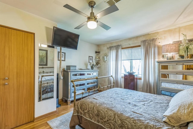 26 Waunona Woods Ct, Madison, WI 53713 - bedroom with wood finished floors, ceiling fan, and baseboards