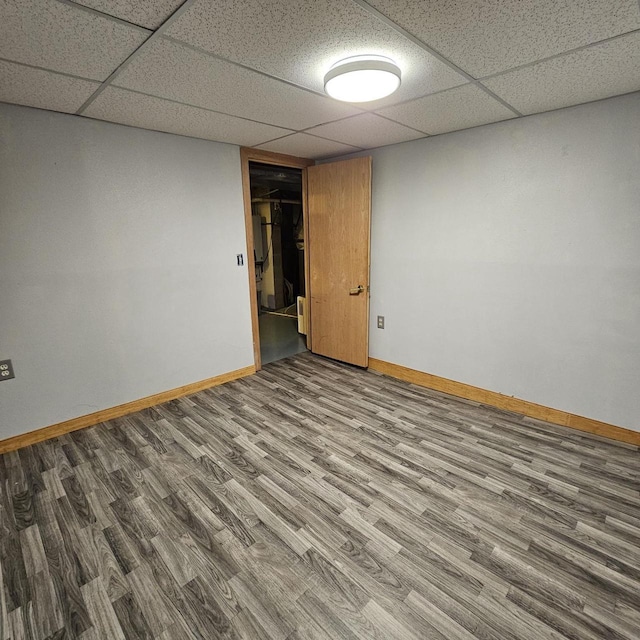 26 Waunona Woods Ct, Madison, WI 53713 - finished below grade area with baseboards, wood finished floors, and a paneled ceiling