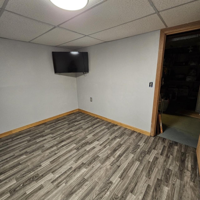 26 Waunona Woods Ct, Madison, WI 53713 - finished basement featuring a paneled ceiling, wood finished floors, and baseboards