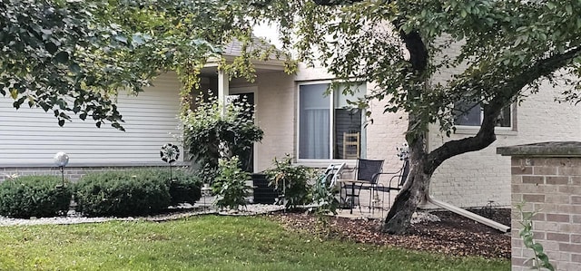 26 Waunona Woods Ct, Madison, WI 53713 - view of property exterior with a lawn