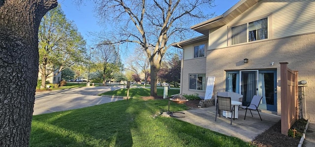 26 Waunona Woods Ct, Madison, WI 53713 - view of green lawn with a patio area