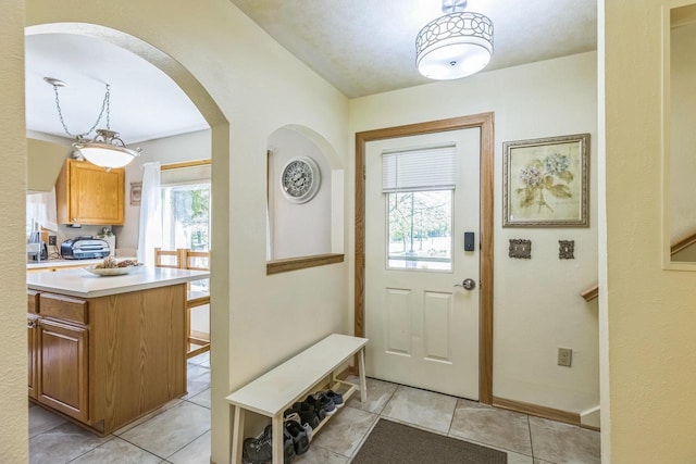 26 Waunona Woods Ct, Madison, WI 53713 - entryway featuring arched walkways and light tile patterned floors