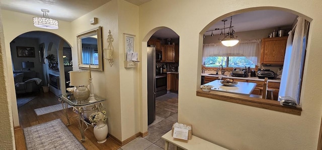 26 Waunona Woods Ct, Madison, WI 53713 - hallway featuring a sink, baseboards, and tile patterned floors