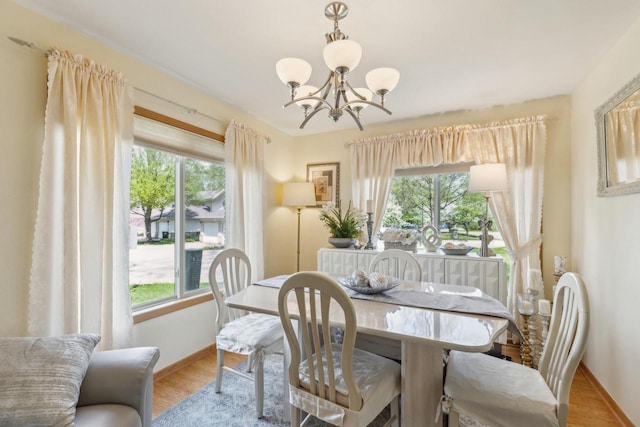 26 Waunona Woods Ct, Madison, WI 53713 - dining area featuring healthy amount of natural light, a chandelier, and baseboards