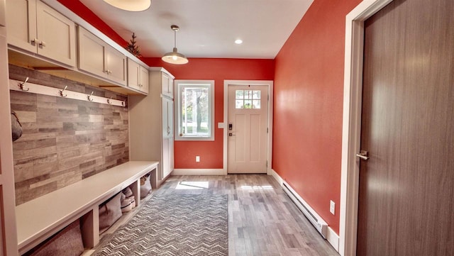 W7660 State Road 21, Wautoma, WI 54982 - mudroom with a baseboard heating unit, light wood-type flooring, baseboards, and recessed lighting