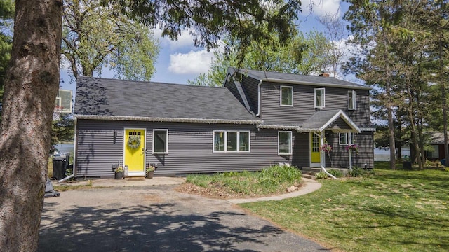 W7660 State Road 21, Wautoma, WI 54982 - view of front facade with a front lawn, a chimney, and asphalt driveway