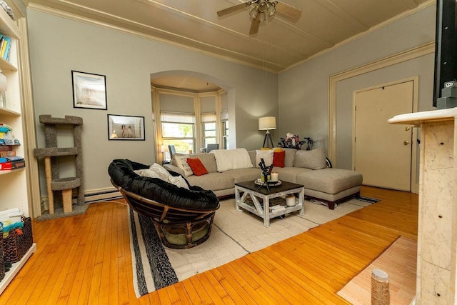 306 Wisconsin St, Oshkosh, WI 54901 - living area with hardwood / wood-style floors, ornamental molding, ceiling fan, a baseboard heating unit, and arched walkways