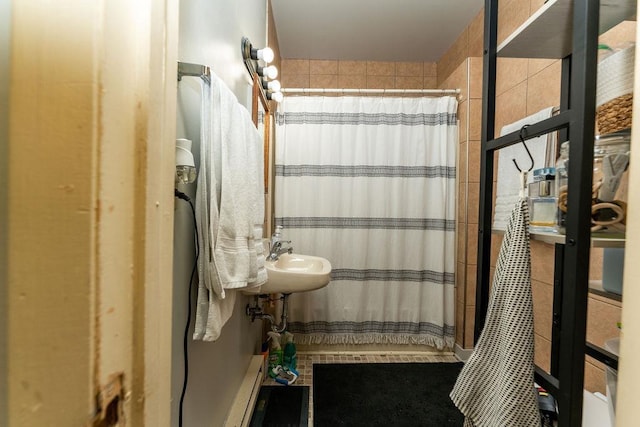 306 Wisconsin St, Oshkosh, WI 54901 - bathroom featuring a shower with curtain and a sink