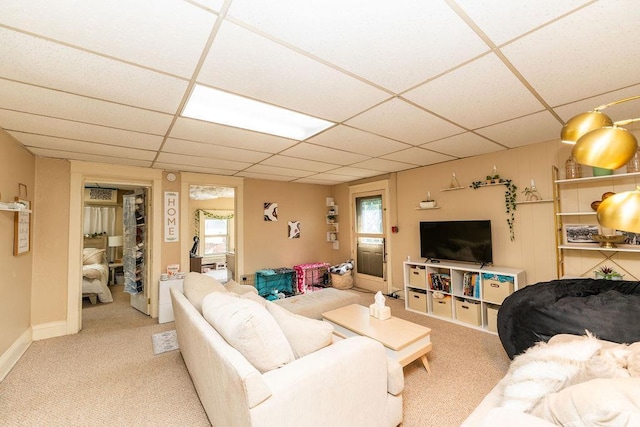 306 Wisconsin St, Oshkosh, WI 54901 - carpeted living room with a paneled ceiling and baseboards